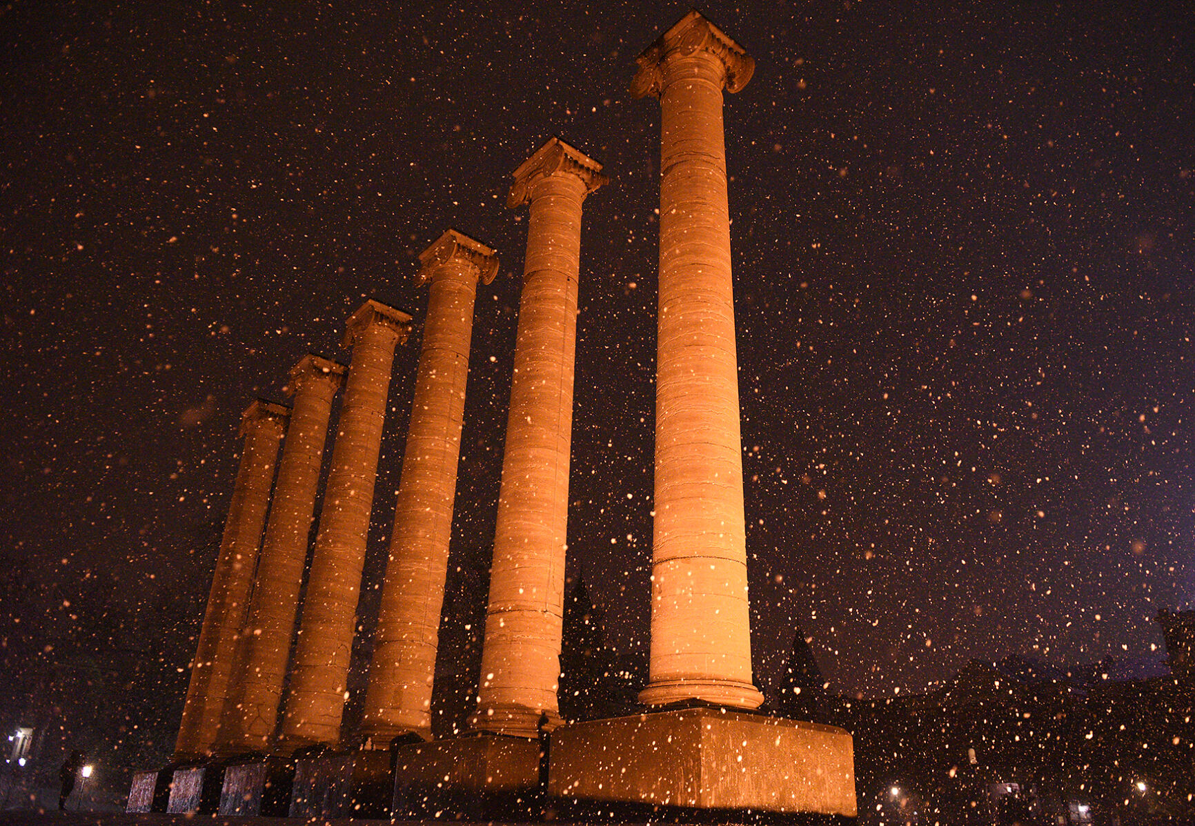 Snow falls around the Columns